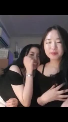 Two Korean Girls Kissing image